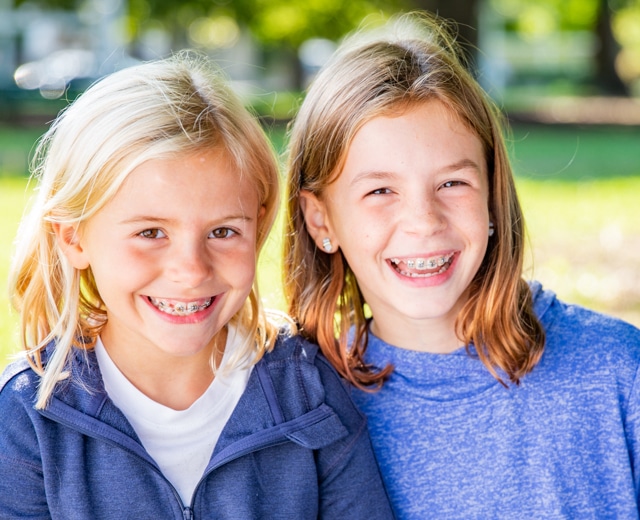 Girls wearing braces at Twelve Corners Orthodontics & Pediatric Dentistry in Rochester, NY
