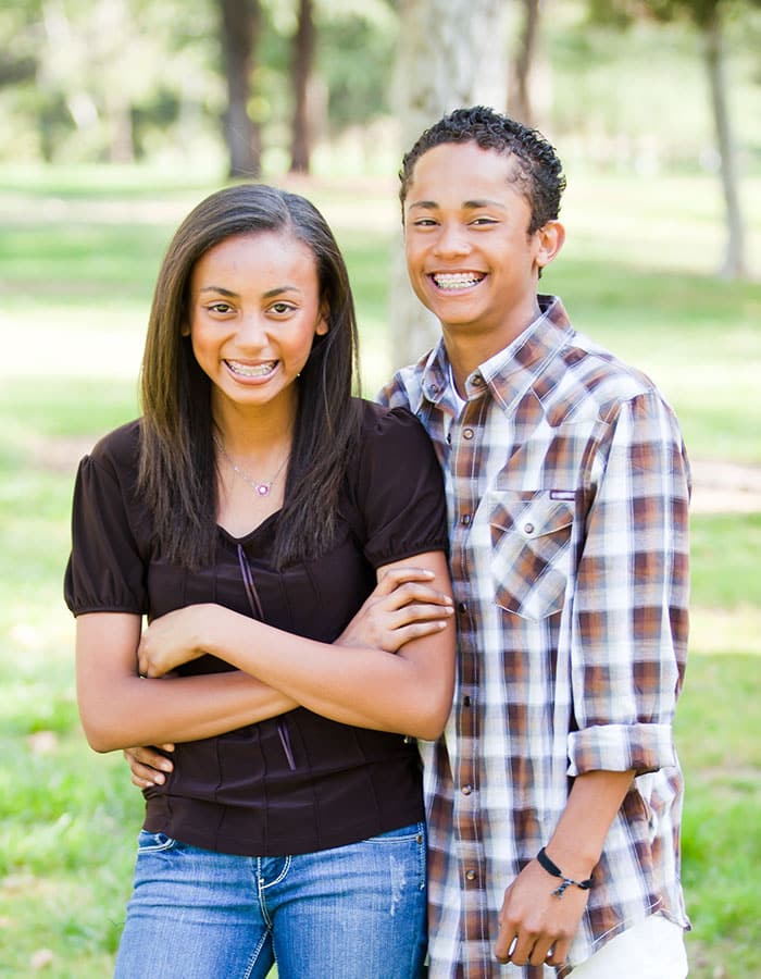 Brother and sister laughing at Twelve Corners Orthodontics & Pediatric Dentistry in Rochester, NY